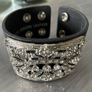 New black leather and rhinestone cuff bracelet. Snap closure